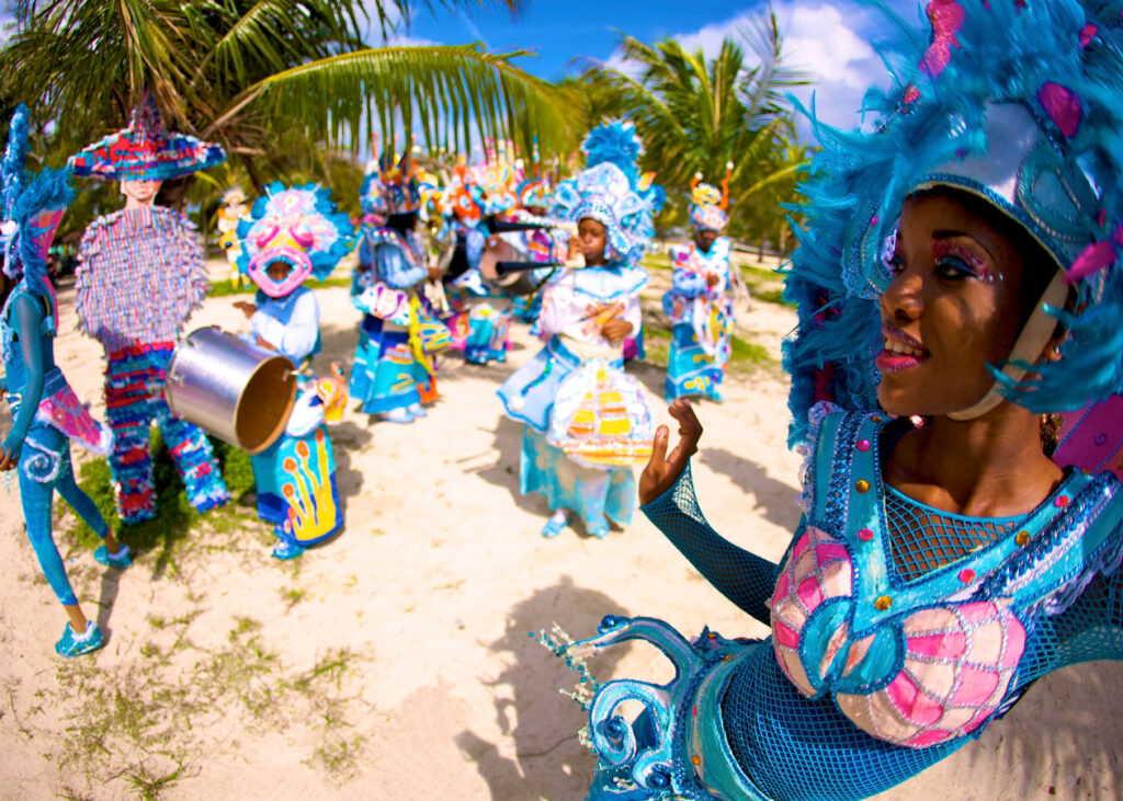 cultural festivites where people are dressed in traditional outfits of blue and pink celebrating